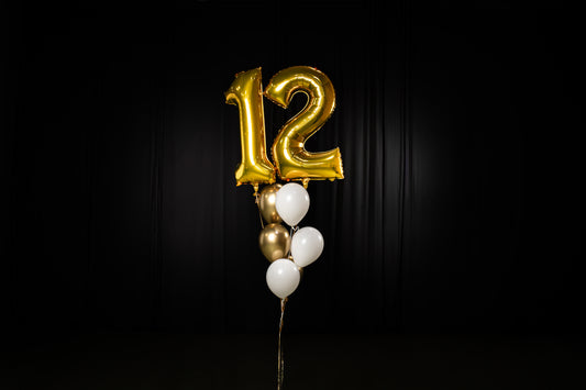 Two Mylar Number Balloons, 6 Latex Balloons, and a Balloon Weight